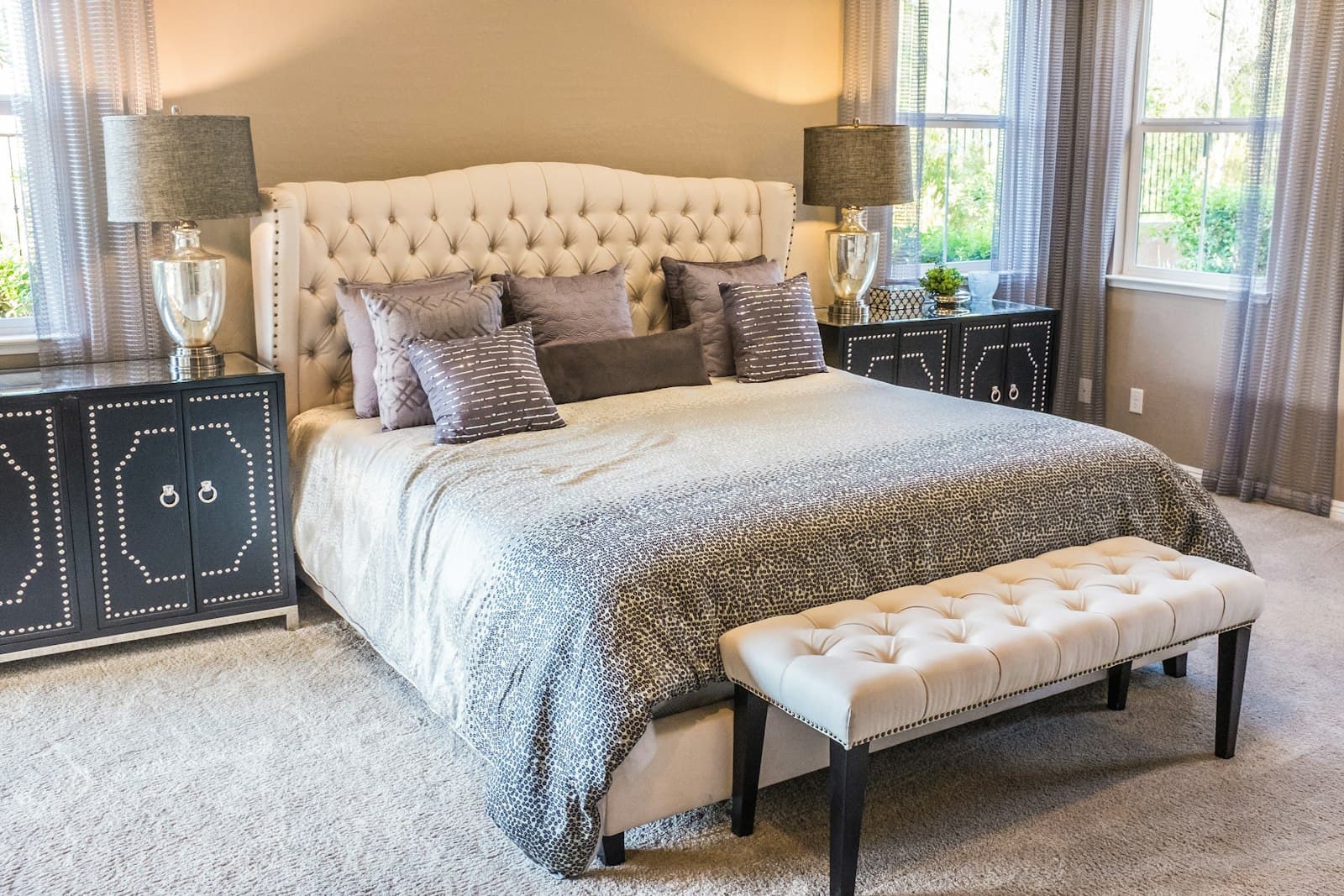 Freshly made bed with a clean mattress in a calm bedroom